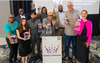 Several people holding awards at the 15th annual Crowns of Enterprise ceremony